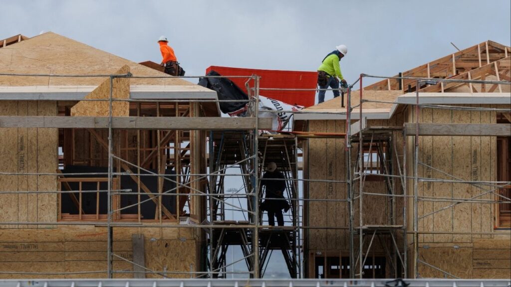 Construction workers use wood and lumber to build residential homes in Irvine, California, U.S., March 28, 2025. (Reuters/Mike Blake)
