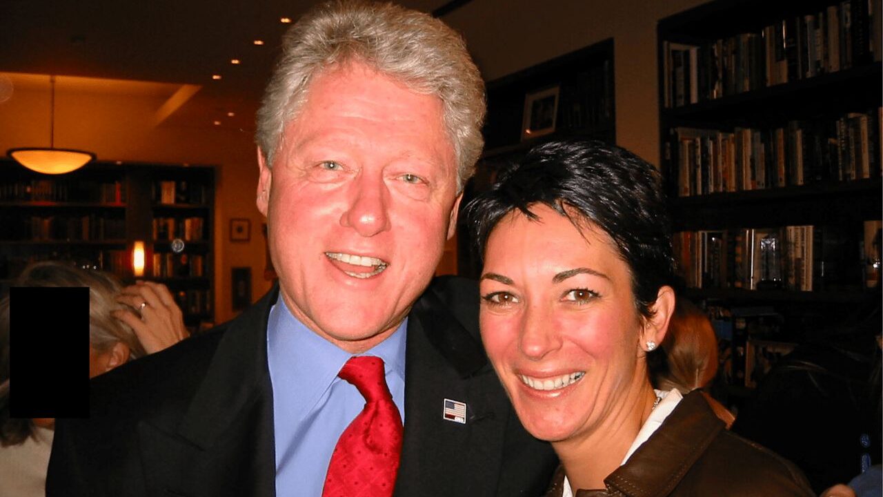 Image of former president Bill Clinton smiling in a blue shirt and jacket and red tie with Ghislaine Maxwell