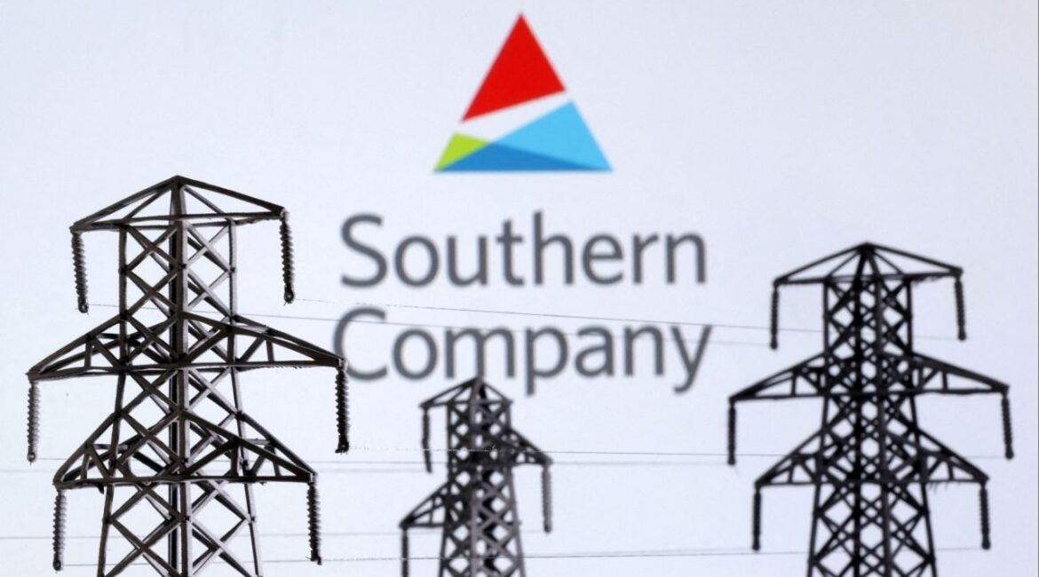 Electric power transmission pylon miniatures and Southern Company logo are seen in this illustration taken, December 9, 2022. (Reuters File)