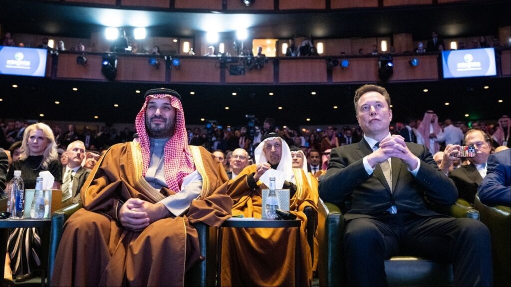 Elon Musk and Saudi Arabia Crown Prince Mohammed bin Salman listen as President Donald Trump delivers remarks at a Saudi Arabia Investment forum at the Kennedy Center in Washington, Nov. 19, 2025. Humain, which was created by Crown Prince Mohammed bin Salman last year, said it made the investment just before xAI was acquired by SpaceX. (Haiyun Jiang/The New York Times)