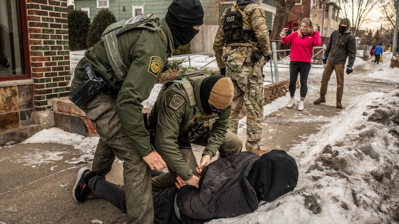 Federal agents detain a man after a foot chase in Minneapolis, Jan.11, 2026. Congressional Democrats say they will approve no money for the Department of Homeland Security without guardrails on immigration agents. Their voters in Minnesota are demanding no less. (David Guttenfelder/ The New York Times)