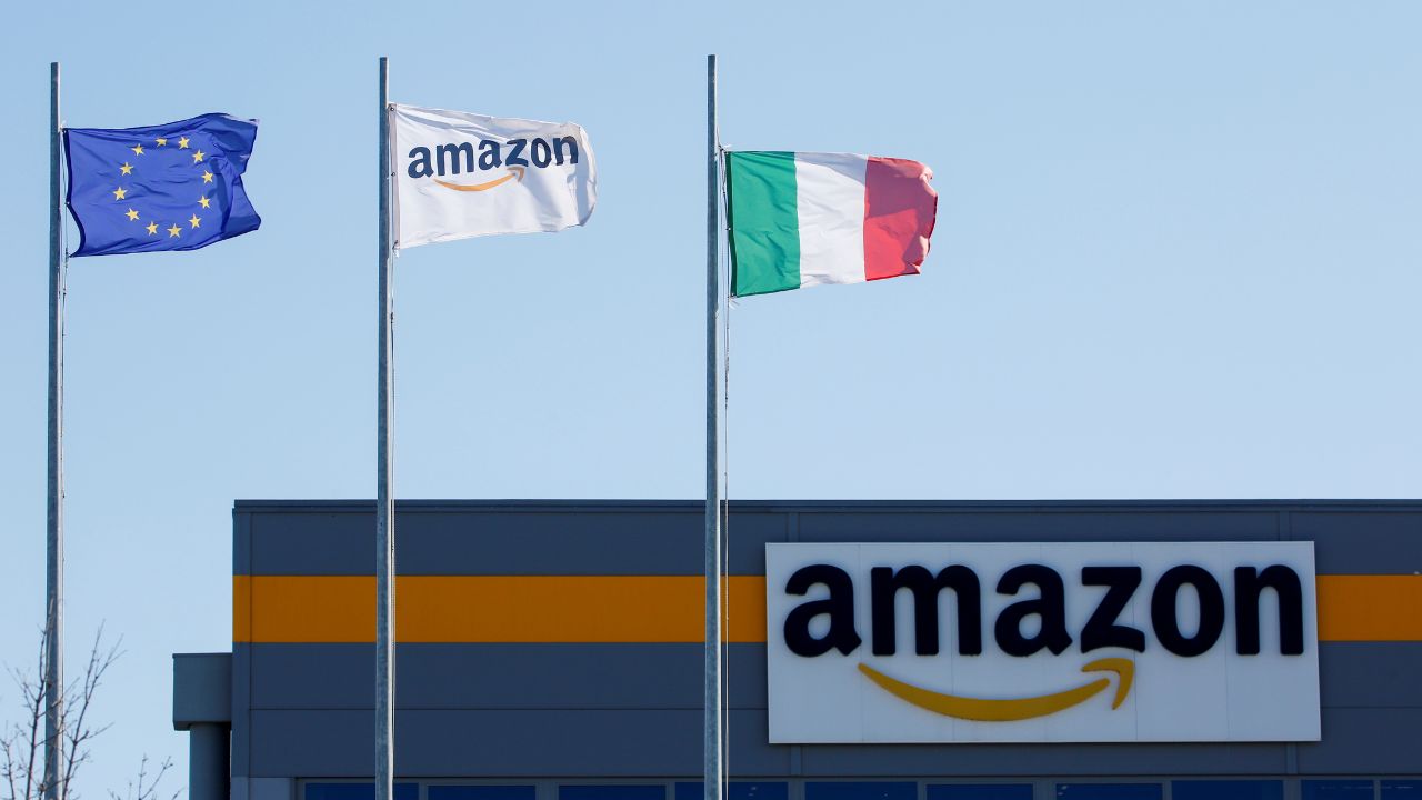 Flags flutter outside a distribution centre, during a strike at Amazon's logistics operations in Italy, in Passo Corese, Italy March 22, 2021. (Reuters/Remo Casilli)