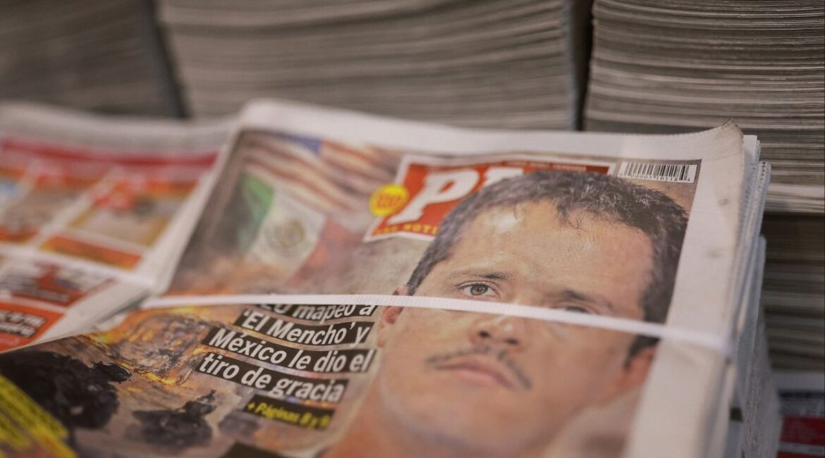 Freshly printed copies of the newspaper PM bearing the headline "U.S. mapped ‘El Mencho’ and Mexico delivered the final blow, Caught between two fires," are seen at a printing facility, following the killing of drug lord Nemesio Oseguera, known as 'El Mencho,' in a military operation on Sunday, in Ciudad Juarez, Mexico, February 22, 2026. (Reuters/Jose Luis Gonzalez)