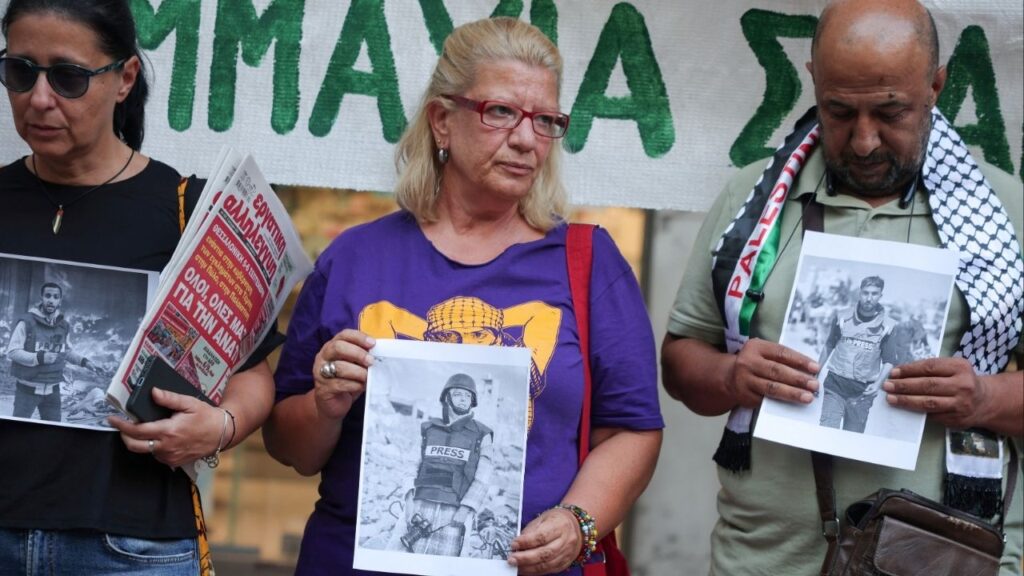 Greek and foreign journalists hold pictures of recently killed journalists in Gaza, during a protest outside the Union of Greek Journalists in Athens, Greece, September 4, 2025. (Reuters/Louisa Gouliamaki)