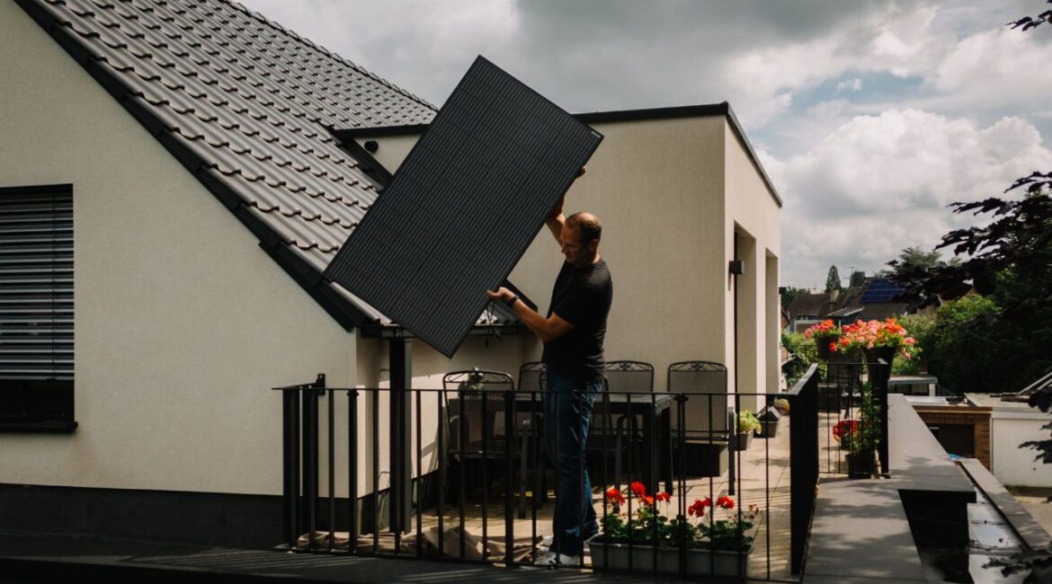 Heiko Billen looks for the best place to install a solar panel on the balcony of his home in Dusseldorf, Germany, July 10,2024. As the Trump administration stymies hundreds of commercial solar and wind projects nationwide, legislators in 24 states want to literally put the power in the hands of the people by allowing modest solar enegry systems on balconies, porches and backyards. (Patrick Junker/ The New York Times)
