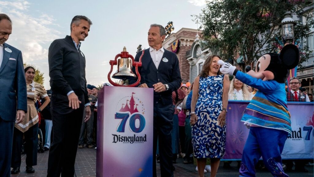 Josh D’Amaro, center left, chairman of the Disney Experiences division of the Walt Disney Company, and Robert Iger, center right, Disney’s chief executive, at an event marking the 70th anniversary of Disneyland in Anaheim, Calif., on July 17, 2025. D’Amaro, a 28-year company veteran with vast theme park experience but little expertise in movies and television, will succeed Iger as Disney’s chief executive, ending a nearly three-year search, the company said on Tuesday, Feb. 3, 2026. (Mark Abramson/The New York Times)