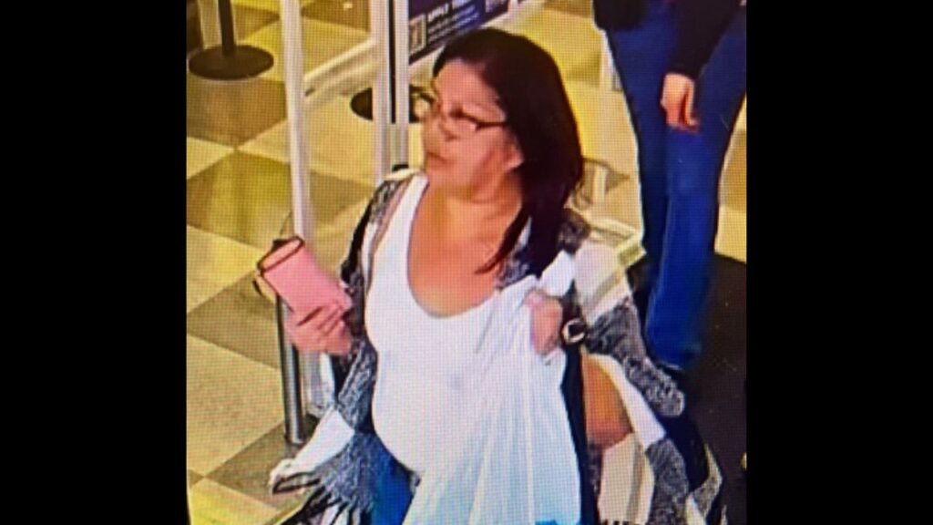 Madera police are seeking the public's help to identify a woman captured on surveillance video stealing another customer's purse from a local business. (Madera PD)