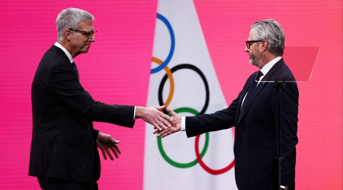 Milano Cortina 2026 Winter Olympics - 145th IOC Session - Auditorium MPC, Milan, Italy - February 3, 2026 Chairman of the Los Angeles Organizing Committee for the 2028 Olympic and Paralympic Games, Casey Wasserman with Reynold Hoover, chief executive officer of the 2028 Summer Olympics during the 145th IOC Session. (Reuters File)