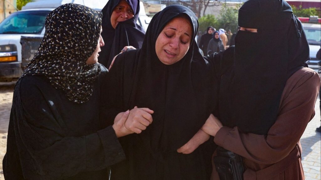 Mourners react during the funeral of Palestinians killed in an overnight Israeli strike, according to medics, at Nasser Hospital in Khan Younis in the southern Gaza Strip, February 15, 2026. (Reuters/Ramadan Abed)