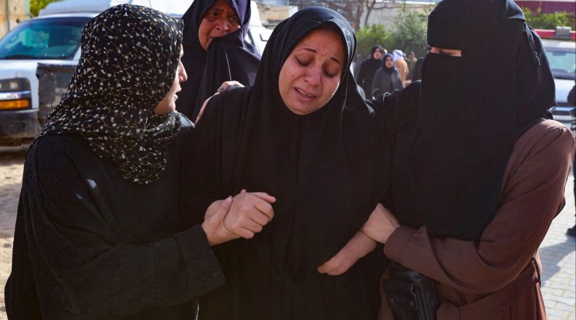Mourners react during the funeral of Palestinians killed in an overnight Israeli strike, according to medics, at Nasser Hospital in Khan Younis in the southern Gaza Strip, February 15, 2026. (Reuters/Ramadan Abed)