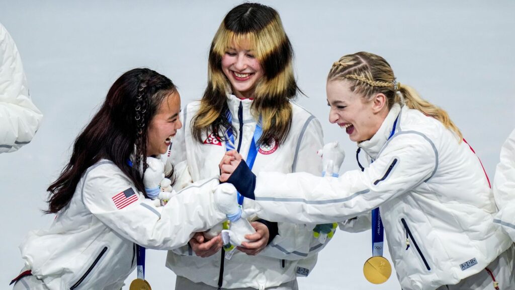 Image of American figure skaters celebrating their gold medals