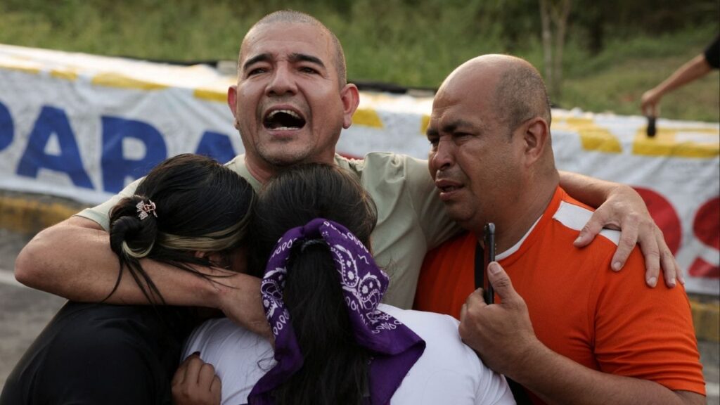Pastor Richard Puentes hugs his family after his release from the Rodeo detention center, after Venezuelan lawmakers approved a limited amnesty bill for certain prisoners, in Guatire, Venezuela February 23, 2026. (Reuters/Gaby Oraa)