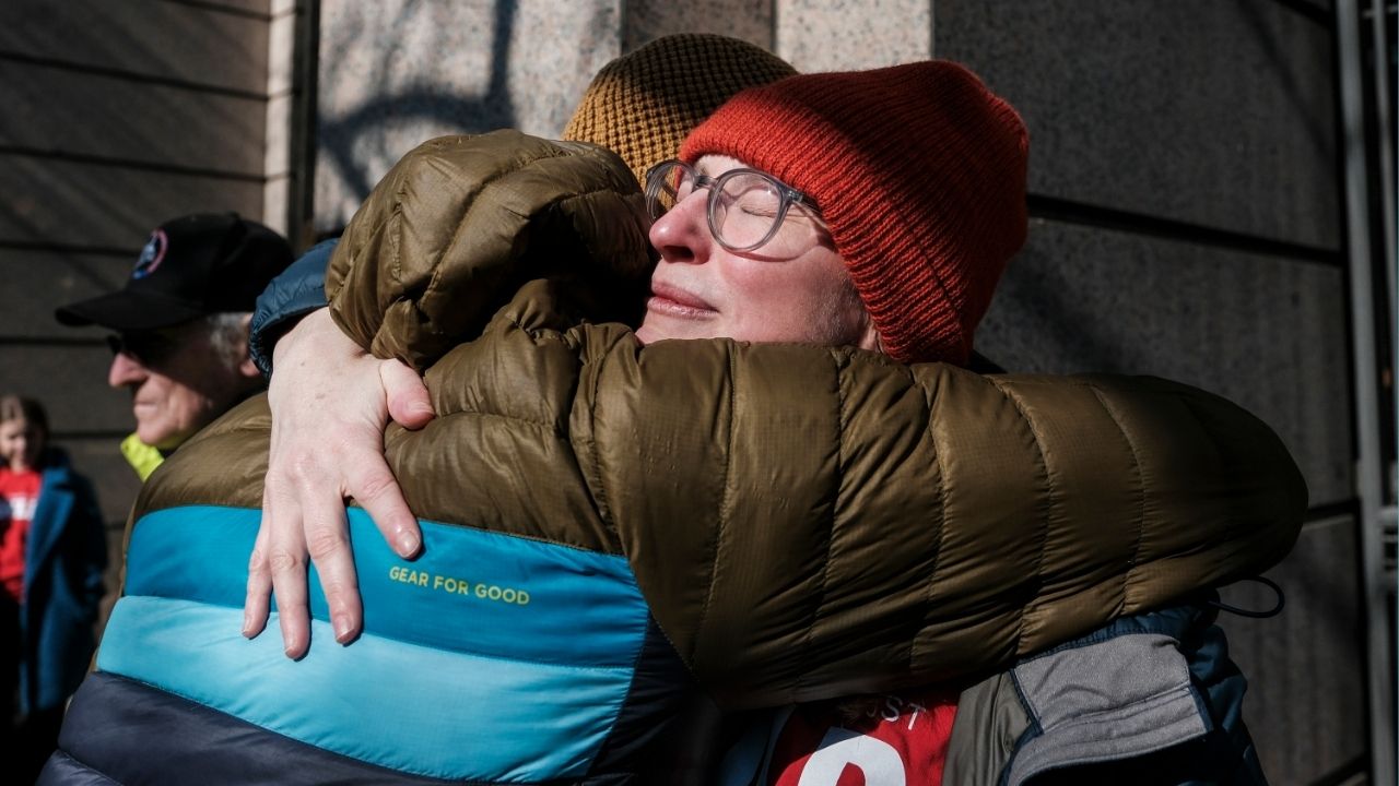 People exchange a hug as former employees of The Washington Post and supporters rally outside of the company’s offices in Washington, on Thursday, Feb. 5, 2026. The Washington Post carried out a widespread round of layoffs on Wednesday that decimated the organization’s sports, local news and international coverage. (Michael A. McCoy/The New York Times)