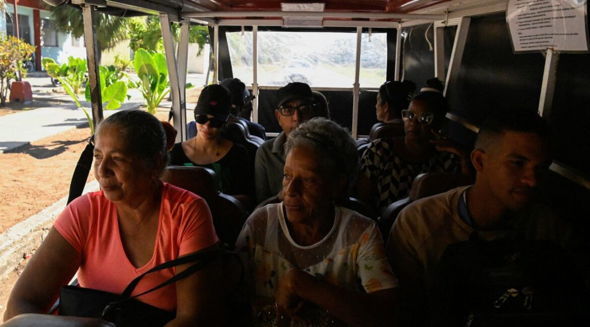 People ride in an electric bus as Cubans face one of the worst fuel shortages in recent years, on the outskirts of Havana, Cuba February 13, 2026. (Reuters/Norlys Perez)