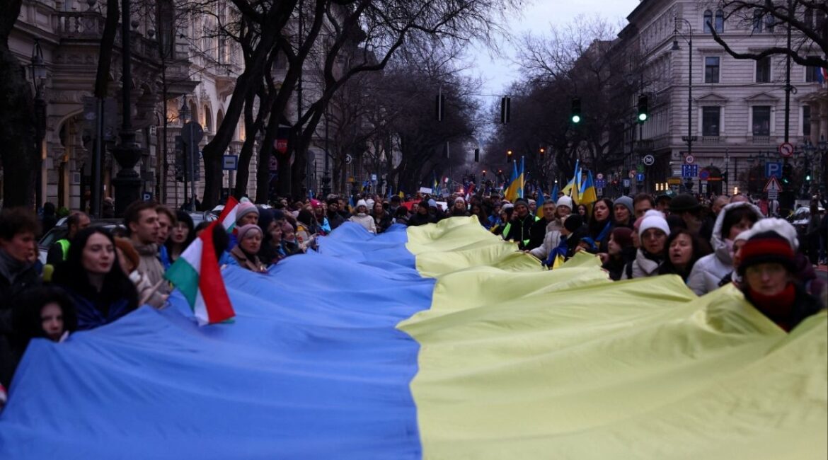 People take part in a solidarity march ahead of the fourth anniversary of the full-scale Russian invasion of Ukraine, in Budapest, Hungary February 22, 2026. (Reuters/Bernadett Szabo)