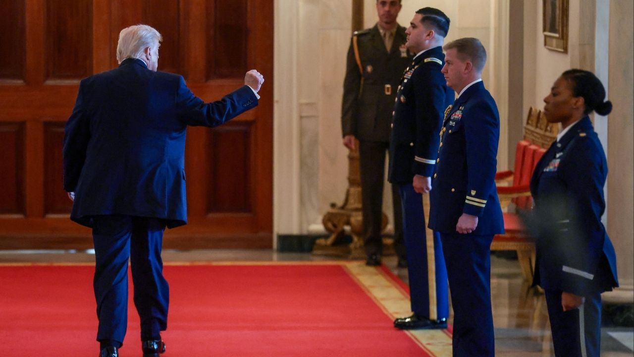 President Donald Trump raises his fist as he leaves at the end of an event to honor "Angel Families" who have lost family members to crimes committed by people in the country illegally, at the White House in Washington, D.C., U.S., February 23, 2026. (Reuters/Evelyn Hockstein)