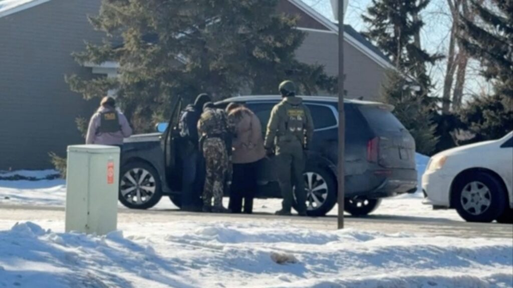 Rebecca Ringstrom is detained by federal immigration agents, as she observed an immigration enforcement operation in her neighborhood, in Blaine, Minnesota, U.S., January 29, 2026, in this screen grab obtained from a video. (Collette Adkins/via Reuters)