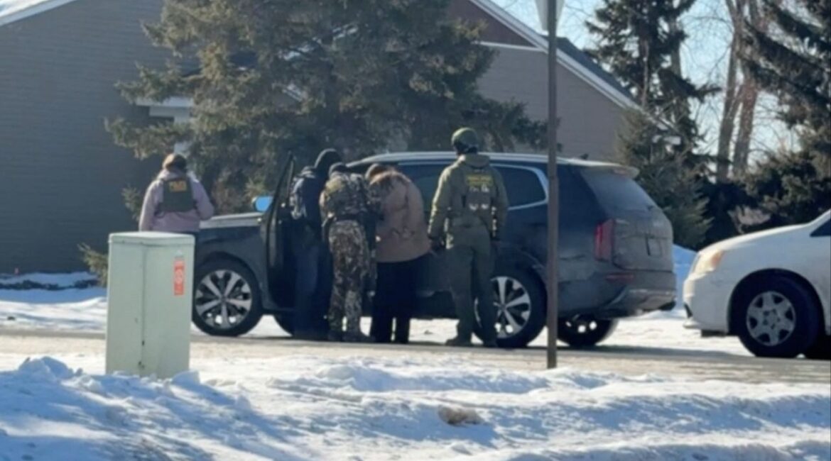 Rebecca Ringstrom is detained by federal immigration agents, as she observed an immigration enforcement operation in her neighborhood, in Blaine, Minnesota, U.S., January 29, 2026, in this screen grab obtained from a video. (Collette Adkins/via Reuters)