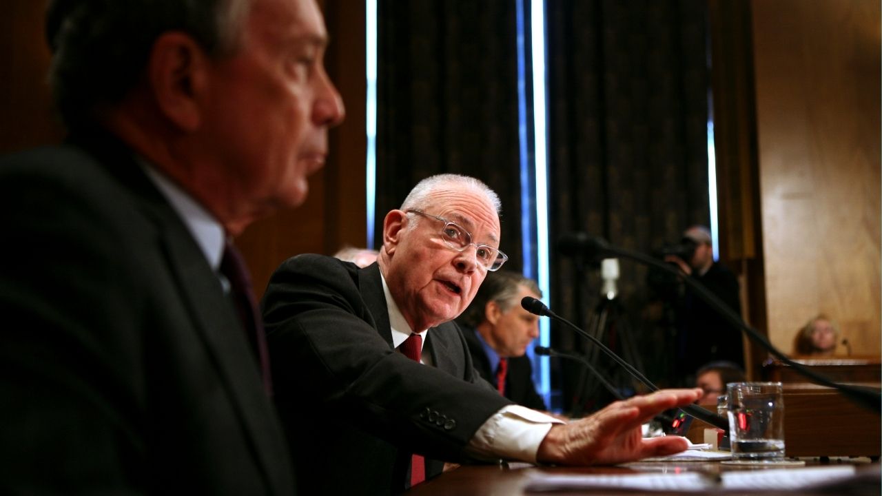 Rep. Lee Hamilton (D-Ind.), chairman of the 9/11 Commission, speaks during a hearing on Capitol Hill in Washington, Jan. 9, 2007. New York Mayor Michael Bloomberg is at left. Hamilton, a former Democratic congressman from rural Indiana who became a major voice in foreign policy during the Iran-Contra affair in the 1980s and in national security investigations after the terrorist attacks of 2001, died on Tuesday, Feb. 3, 2026, at his home in Bloomington, Ind. He was 94. (Doug Mills/The New York Times)