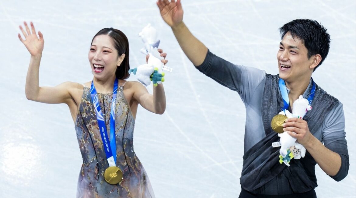 Riku Miura and Ryuichi Kihara of Japan celebrate after winning the gold medal in the pair skating event at the 2026 Winter Games in Milan on Monday, Feb. 16, 2026. (Doug Mills/The New York Times)