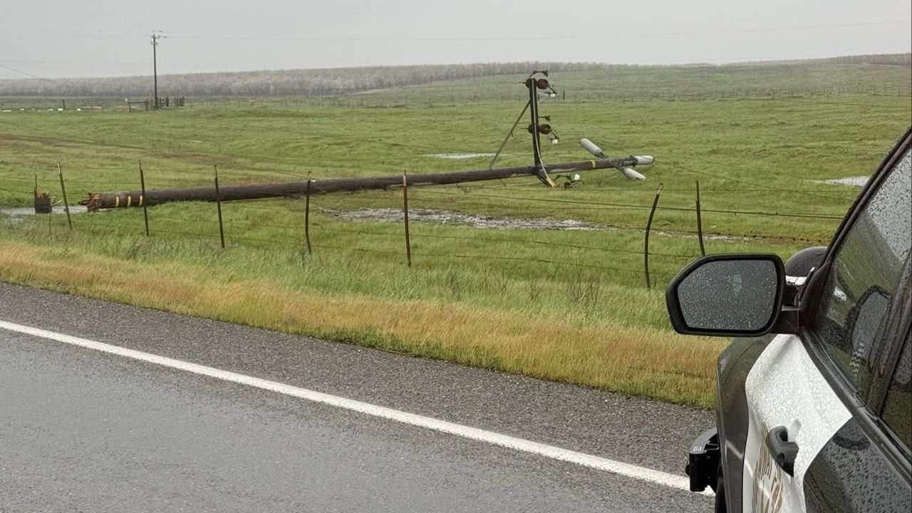 Several power poles are down at Snelling Road and La Paloma Road in Merced County, blocking the roadway and prompting authorities to urge drivers to avoid the area. (CHP)