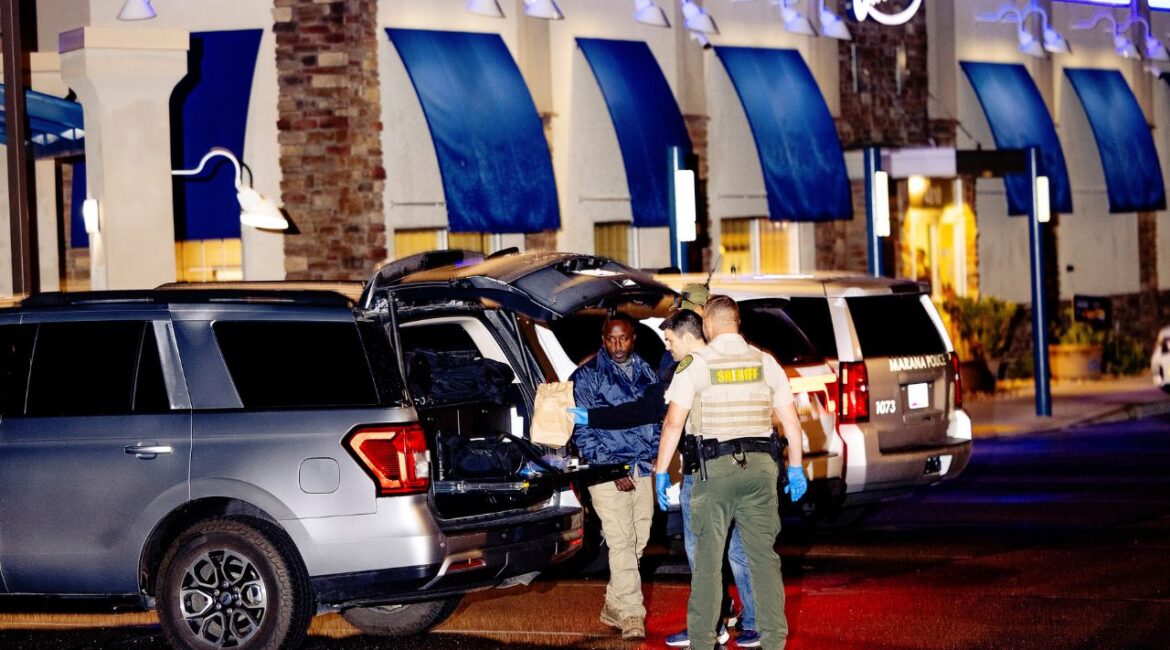 Sheriffs’ deputies and FBI investigators search a gray Range Rover inside and out, in Tucson, Arizona. On Friday Feb.13, 2026. It was unclear if the activity was related to the Guthrie case. (Cassidy Araiza/ The New York Times)