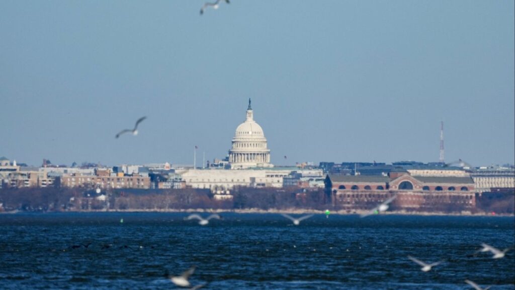 The U.S Capitol is seen across the Potomac River from Alexandria, Virginia, U.S., December 24, 2025. (Reuters/Ken Cedeno)