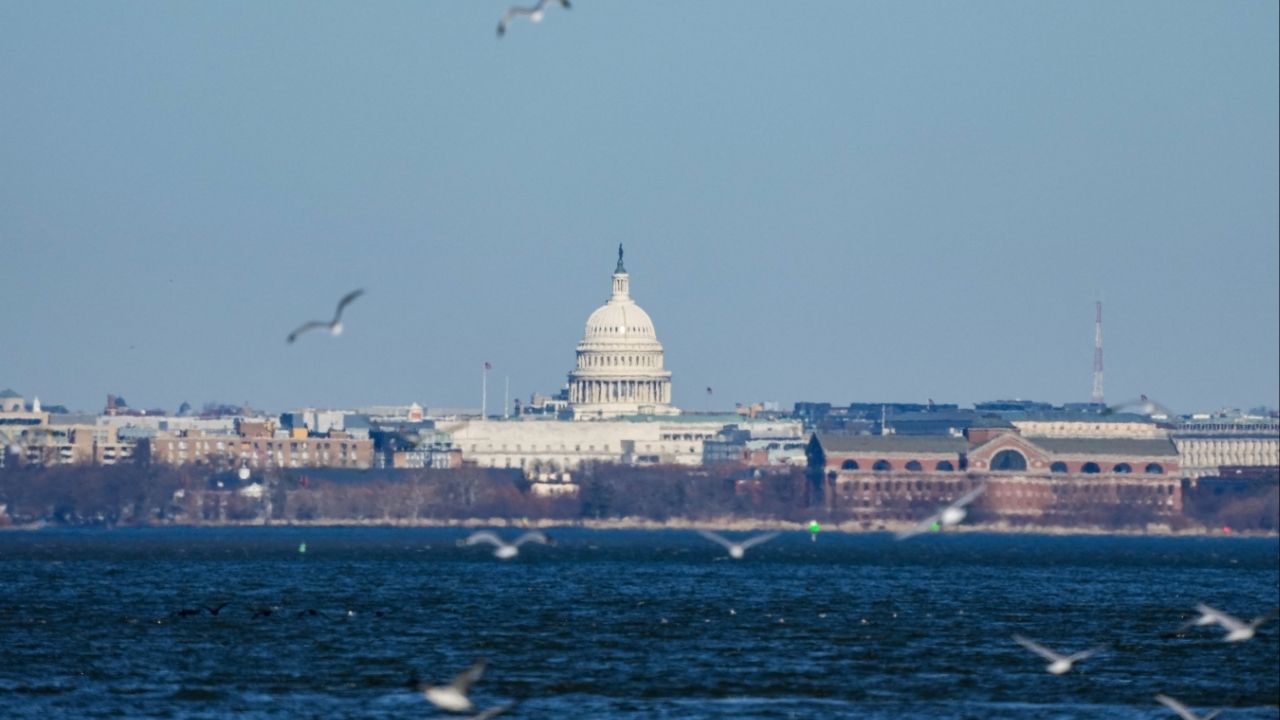 The U.S Capitol is seen across the Potomac River from Alexandria, Virginia, U.S., December 24, 2025. (Reuters/Ken Cedeno)