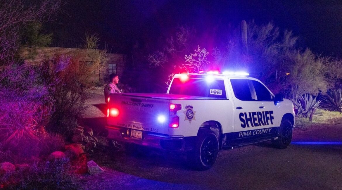 The home of Nancy Guthrie continues to be watched overnight in Tucson, Ariz., Feb. 10, 2026. New images and videos released on Tuesday showed a masked, armed person at Nancy Guthrie’s doorstep on the night she was abducted, the first significant break in the search for the 84-year-old mother of the “Today” show host Savannah Guthrie. (Cassidy Araiza/The New York Times)