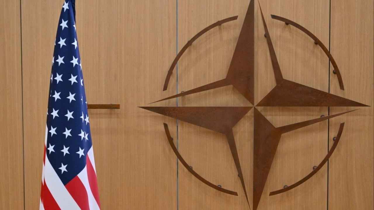 This photo shows the logo of the North Atlantic Treaty Organization (NATO) and the US flag at NATO headquarters in Brussels, Belgium on February 17, 2025. (Nicolas Tucat/Pool via Reuters)