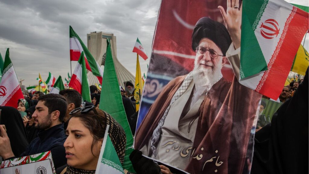 Thousands march carrying the national flag of the Islamic Republic of Iran and protestors of Ayatollah Ali Khamenei, Iran’s supreme leader, to commemorate the 47th anniversary of the Islamic Revolution in Tehran, Iran, Feb. 11, 2026. Iran’s government on Wednesday marked the anniversary of the 1979 Islamic Revolution with mass rallies across the country. (Arash Khamooshi/The New York Times)