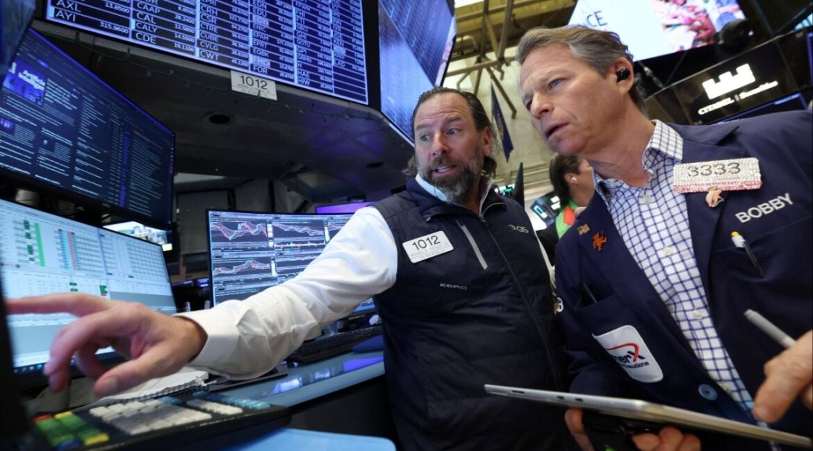 Traders work on the floor at the New York Stock Exchange (NYSE) in New York City, U.S., February 6, 2026. (Reuters/Brendan McDermid)