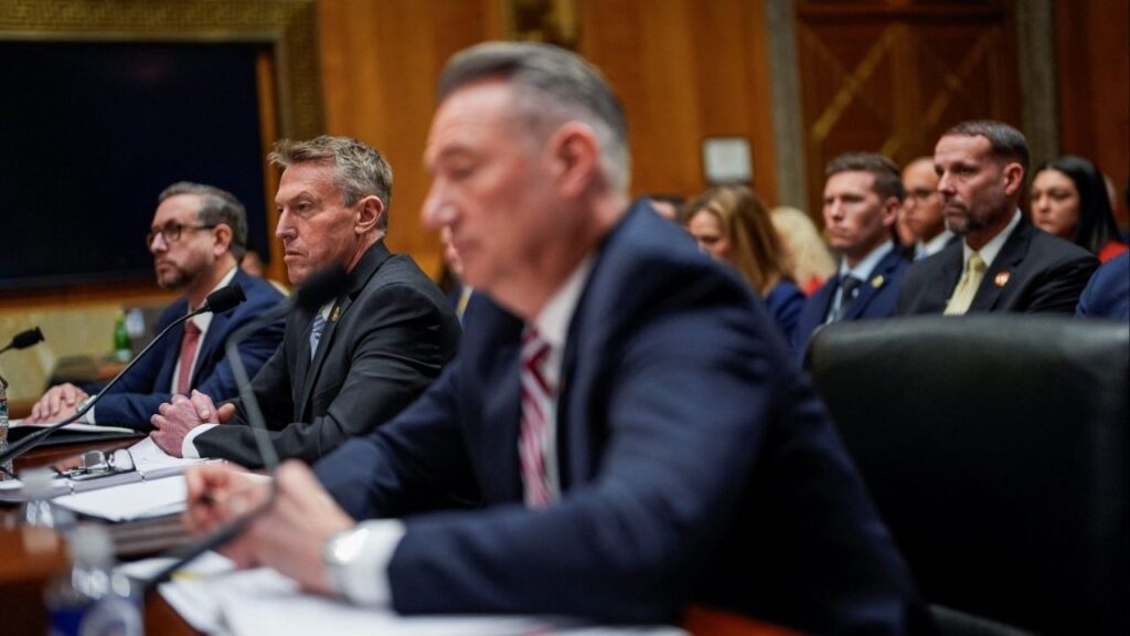 U.S. Customs and Border Protection (CBP) Commissioner Rodney Scott sits next to U.S. Citizenship and Immigration Services (USCIS) Director Joseph Edlow and U.S. Immigration and Customs Enforcement (ICE) Acting Director Todd Lyons as they attend a Senate Homeland Security and Government Affairs Committee hearing on Capitol Hill in Washington, D.C., U.S., February 12, 2026. (Reuters/Kent Nishimura)