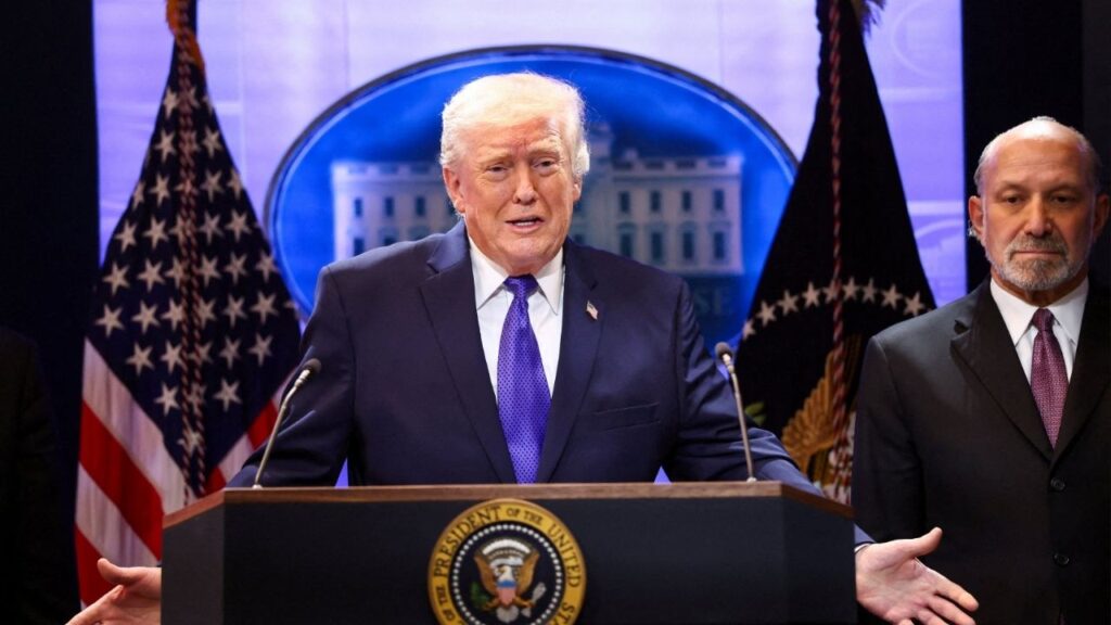 U.S. President Donald Trump, flanked by Secretary of Commerce Howard Lutnick speaks during a press briefing at the White House, following the Supreme Court's ruling that Trump had exceeded his authority when he imposed tariffs, in Washington, D.C., U.S., February 20, 2026. (Reuters/Kevin Lamarque)