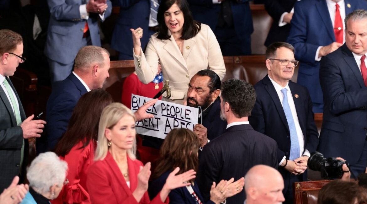 U.S. Rep. Al Green (D-TX) holds a sign as U.S. President Donald Trump delivers the State of the Union address to a joint session of Congress at the U.S. Capitol in Washington, D.C., U.S., February 24, 2026. REUTERS/Evelyn Hockstein