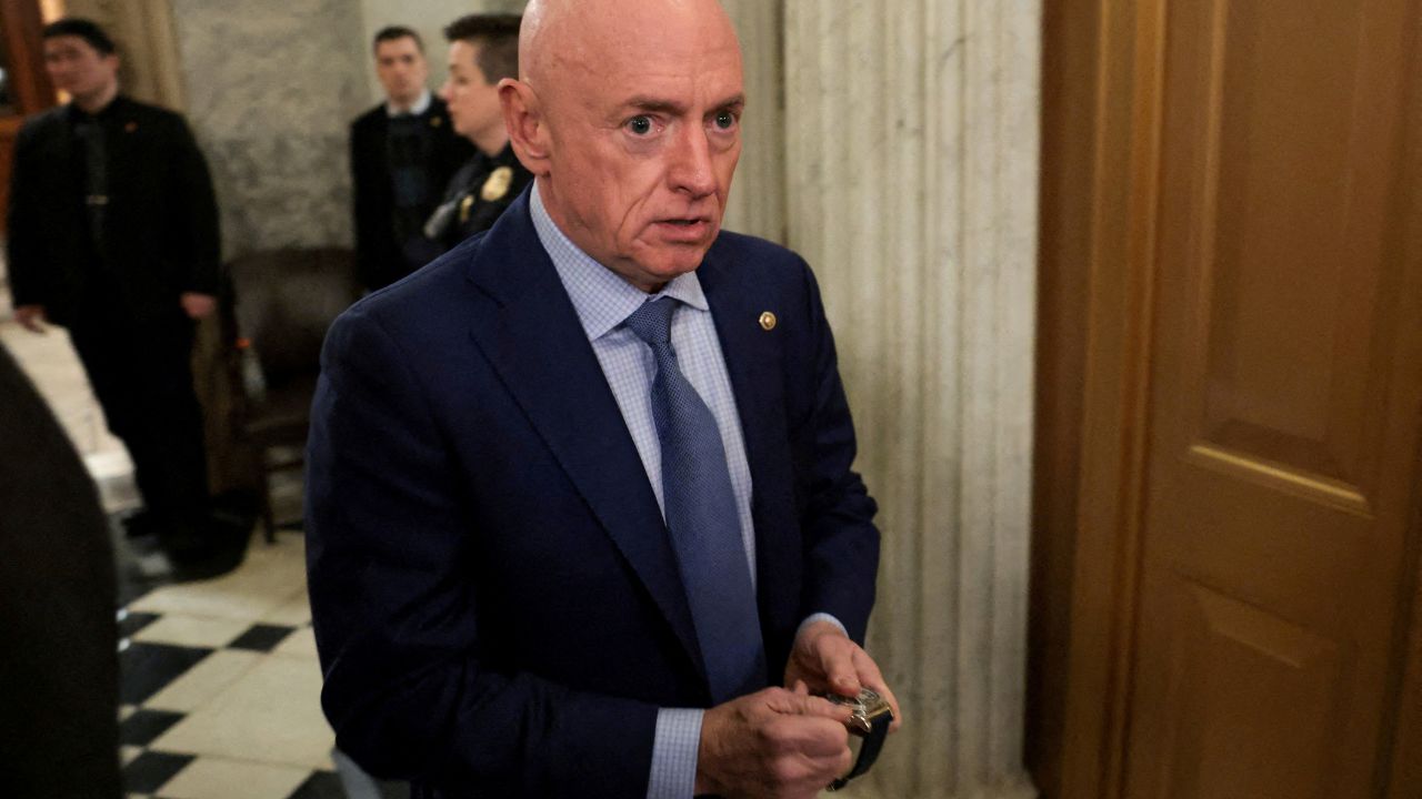 U.S. Senator Mark Kelly (D-AZ) winds his watch as he departs the Senate floor after an evening vote at the U.S. Capitol in Washington, D.C., U.S., January 12, 2026. (Reuters/Jonathan Ernst/File Photo)