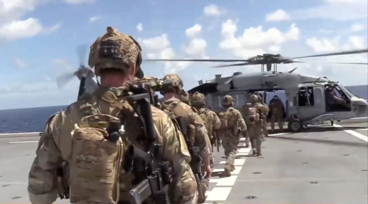 U.S. forces prepare to board the vessel Veronica III, which tried to defy U.S. President Donald Trump's quarantine, according to the U.S. Department of Defense, in what the department said is the INDOPACOM area of responsibility, in this screengrab obtained from a handout video released on February 15, 2026. (Department of War via X/Handout via Reuters)