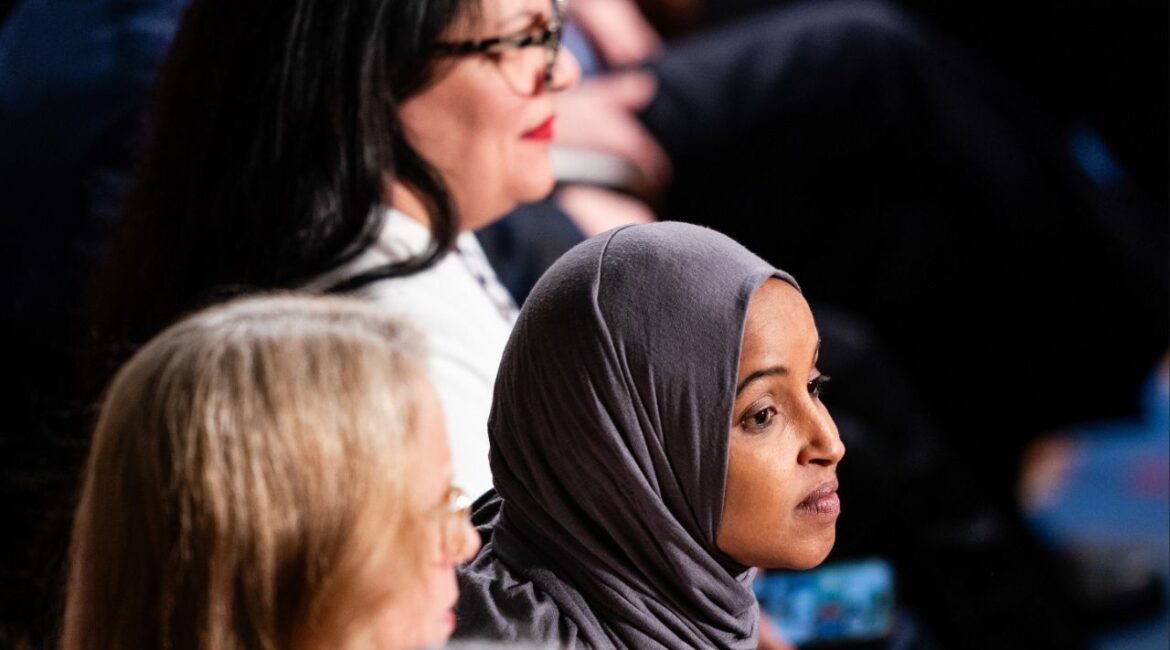 Rep. Ilhan Omar (D-Minn.) listens as President Donald Trump delivers his State of the Union address to a joint session of Congress at the Capitol in Washington, on Tuesday, Feb. 24, 2026. Omar on Wednesday condemned the arrest of a guest she brought to the State of the Union, saying that being charged with a crime for standing up in the gallery during the president’s address “sends a chilling message about the state of our democracy.” (Eric Lee/The New York Times)
