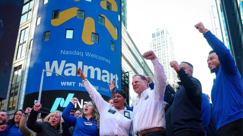 Walmart associates celebrate during the opening bell ceremony at the Nasdaq Market to celebrate the company’s listing transfer, in New York City, U.S., December 9, 2025. (Reuters/Brendan McDermid)