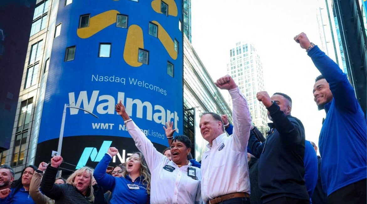 Walmart associates celebrate during the opening bell ceremony at the Nasdaq Market to celebrate the company’s listing transfer, in New York City, U.S., December 9, 2025. (Reuters/Brendan McDermid)
