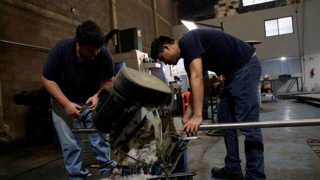 Workers cut a steel bar at a metal-mechanical parts factory in Apodaca, Mexico, March 11, 2025. (Reuters/Daniel Becerril/File Photo)