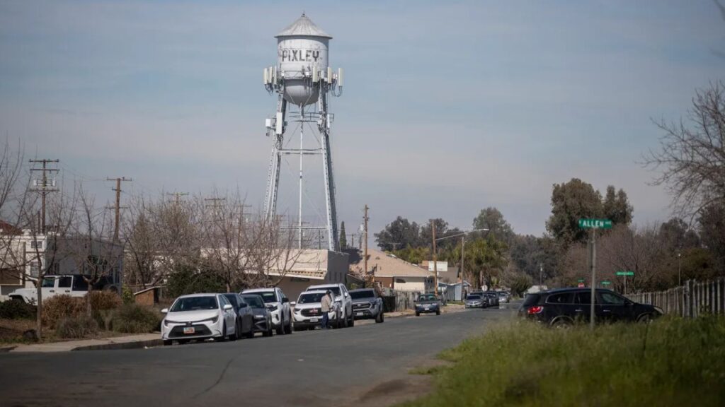 Image of rural Pixley, California, with the town's water tower in the background