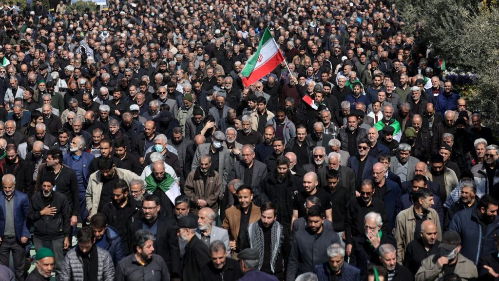 Image of Iranian men attending Friday prayer in Tehran