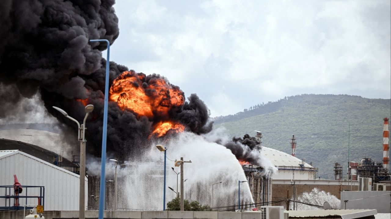 A blaze after Israel's Fire and Rescue Service said that an industrial building and fuel tanker at Israel's Oil Refineries were hit by debris from an intercepted Iranian missile, in Haifa, Israel, March 30. (Reuters/Rami Shlush)