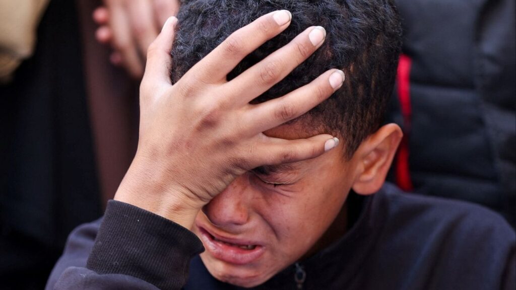 A boy reacts during the funeral of Palestinians who, according to medics, were killed in an Israeli strike, in Gaza City, March 30, 2026. (Reuters/Dawoud Abu Alkas)
