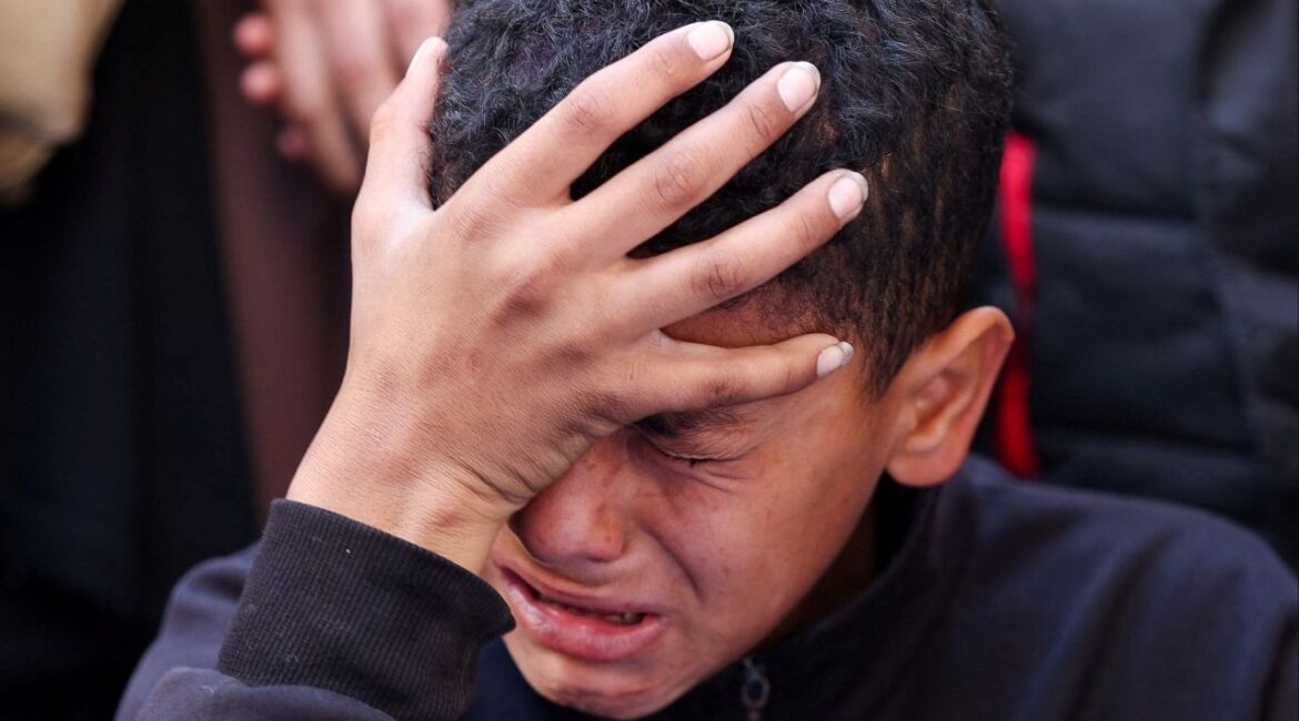 A boy reacts during the funeral of Palestinians who, according to medics, were killed in an Israeli strike, in Gaza City, March 30, 2026. (Reuters/Dawoud Abu Alkas)