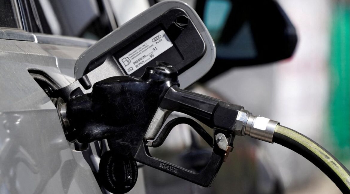 A gas pump is inserted inside an Audi vehicle at a Mobil gas station in Beverly Boulevard in West Hollywood, California, U.S., March 10, 2022. (Reuters File)