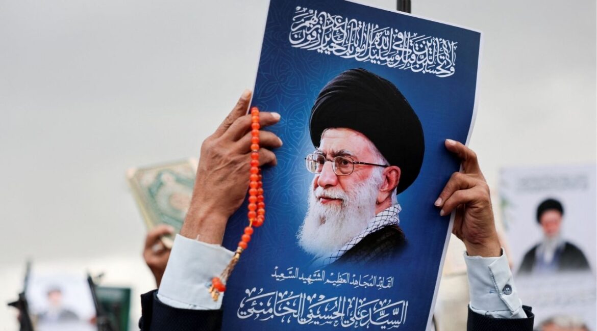 A man holds a poster featuring a picture of late Iran's Supreme Leader Ayatollah Ali Khamenei during a demonstration by Houthi supporters in solidarity with Iran and Lebanon, amid the U.S.-Israeli conflict with Iran, in Sanaa, Yemen March 6, 2026. (Reuters/Khaled Abdullah)