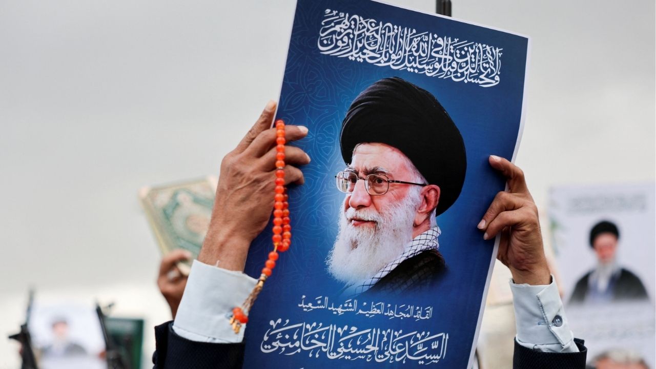 A man holds a poster featuring a picture of late Iran's Supreme Leader Ayatollah Ali Khamenei during a demonstration by Houthi supporters in solidarity with Iran and Lebanon, amid the U.S.-Israeli conflict with Iran, in Sanaa, Yemen March 6, 2026. (Reuters/Khaled Abdullah)