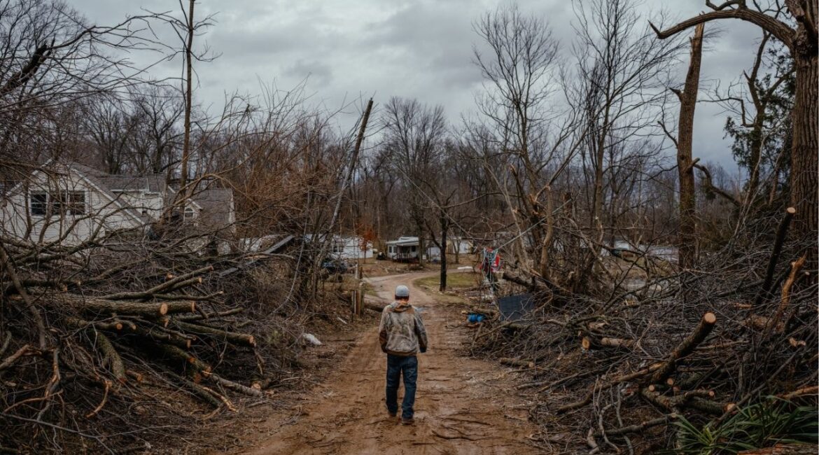 A man walks down a road searching for a friend who had not been heard from in Union City, Mich. on Saturday, March 7, 2026 after a tornado swept through overnight. More severe storms are expected across a large section of the United States this week, with forecasters warning they could deliver all manner of severe weather — including large hail, damaging winds, tornadoes and flooding — anywhere from the southern Plains through the Midwest and into the Northeast. (Jamie Kelter Davis/The New York Times)